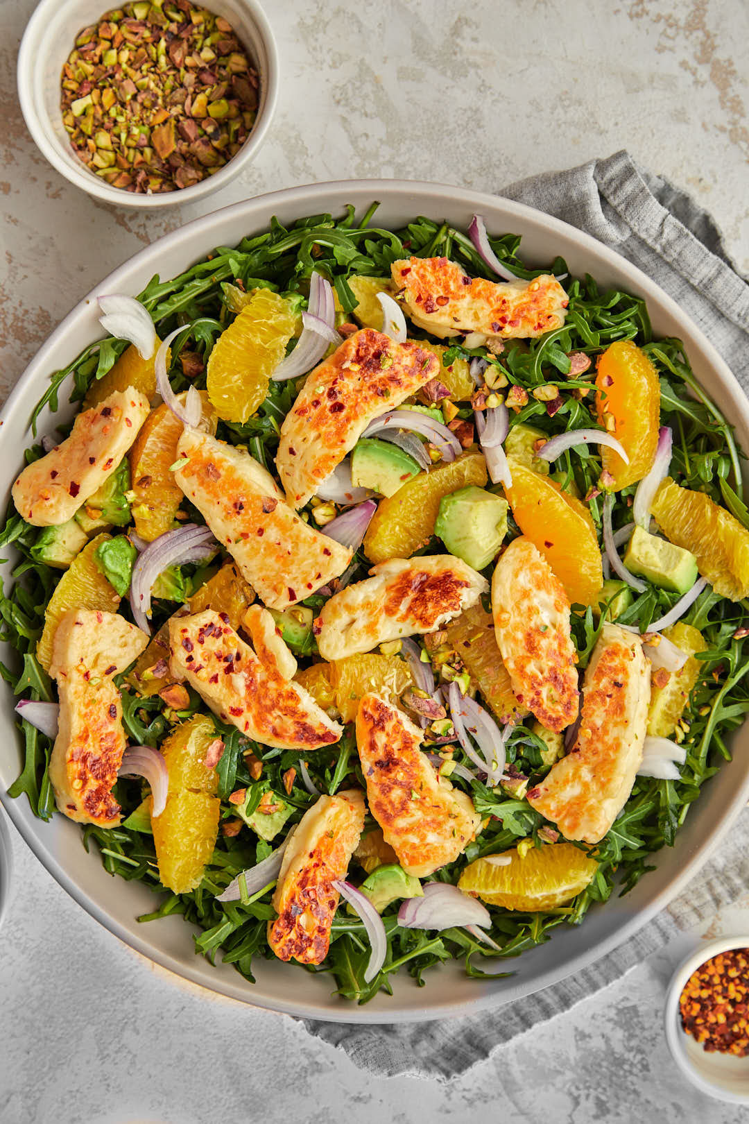 fried halloumi salad in gray serving dish.