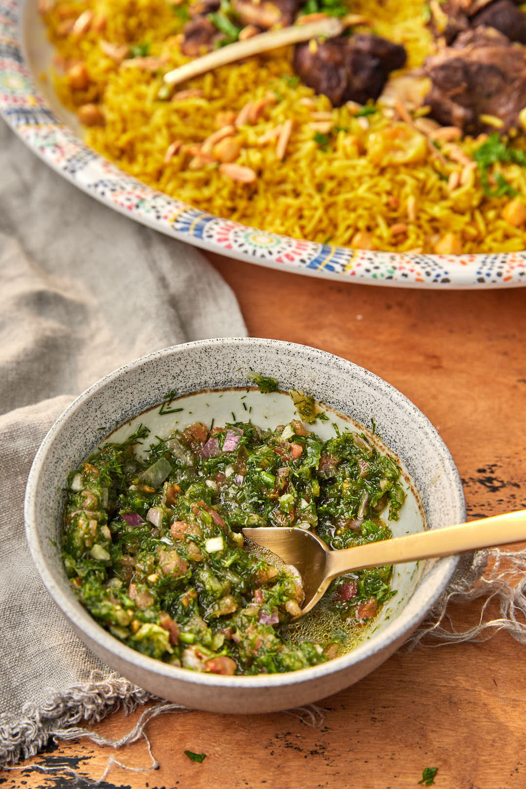 spoon taking a socop of gaza salsa out of a bowl