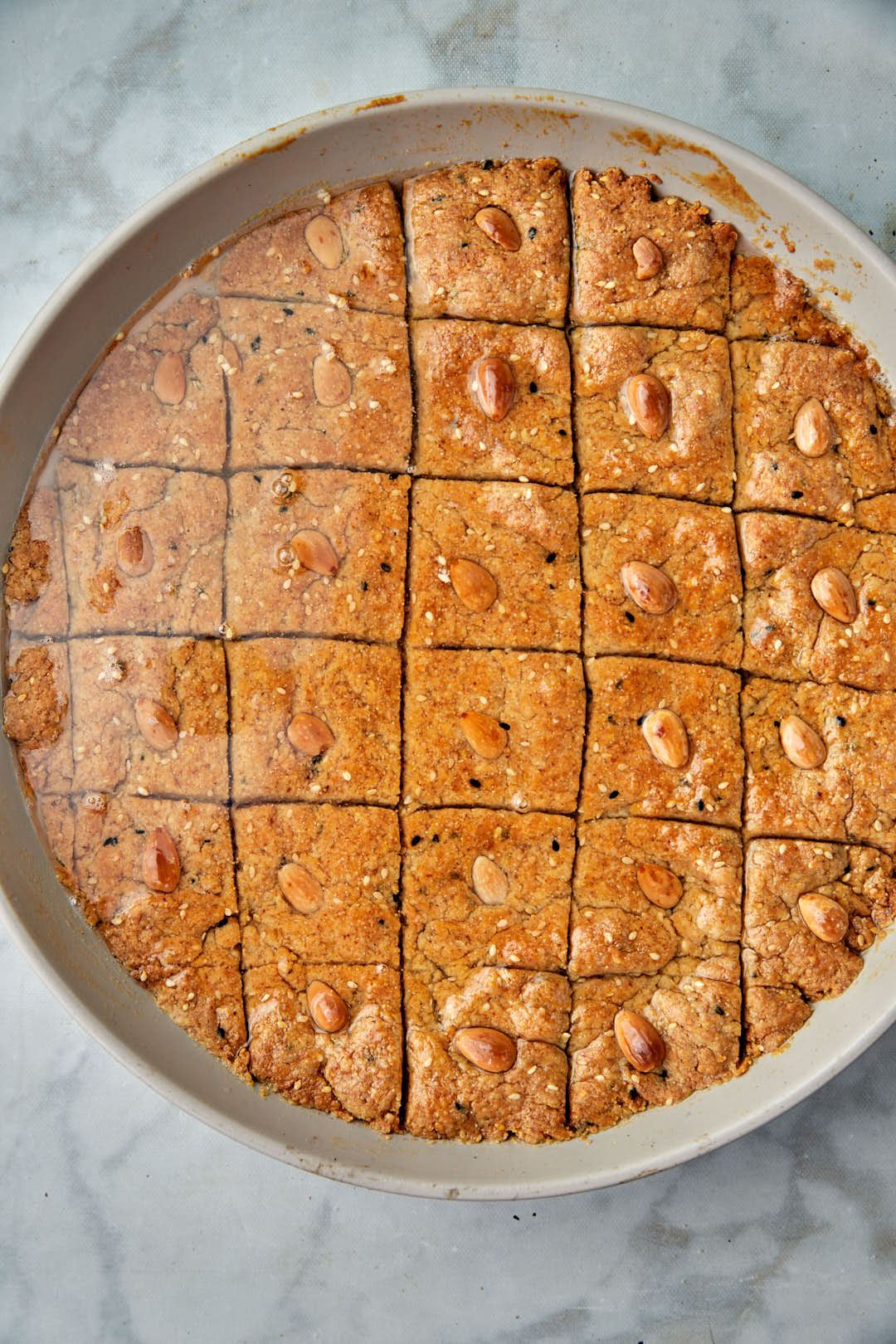 sugar syrup poured on golden brown hilbeh.