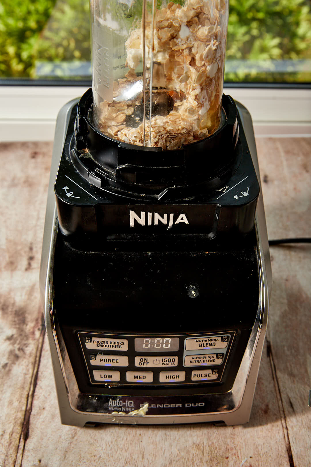 cottage cheese, an egg, and oats in a ninja blender, before blending.