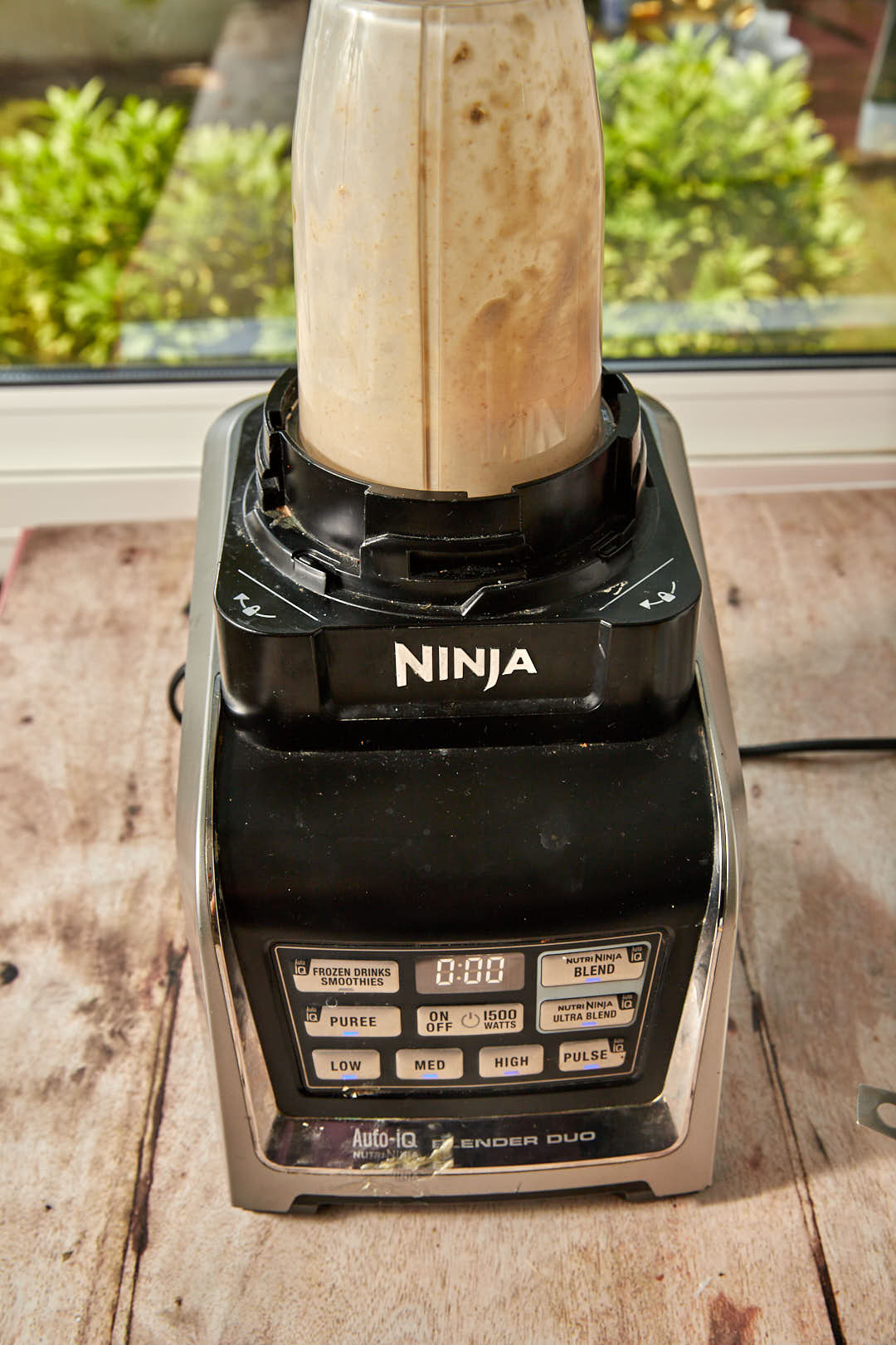 cottage cheese, an egg, and oats in a blender after blending.