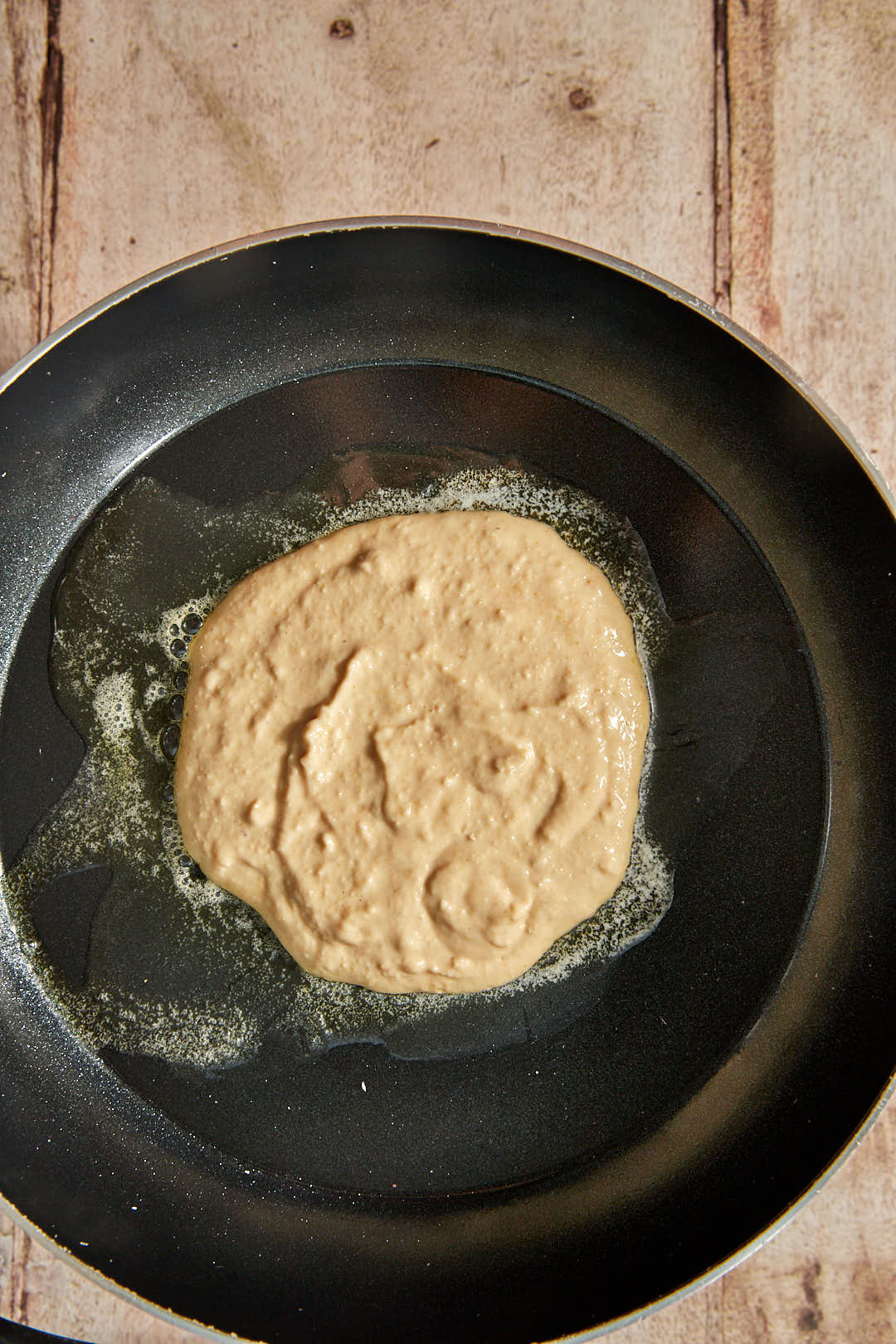 cottage cheese pancake batter in melted butter in a skillet.