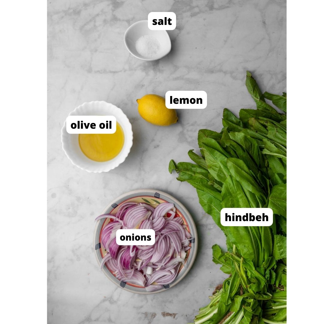 ingredients needed to make hindbeh on a white background.
