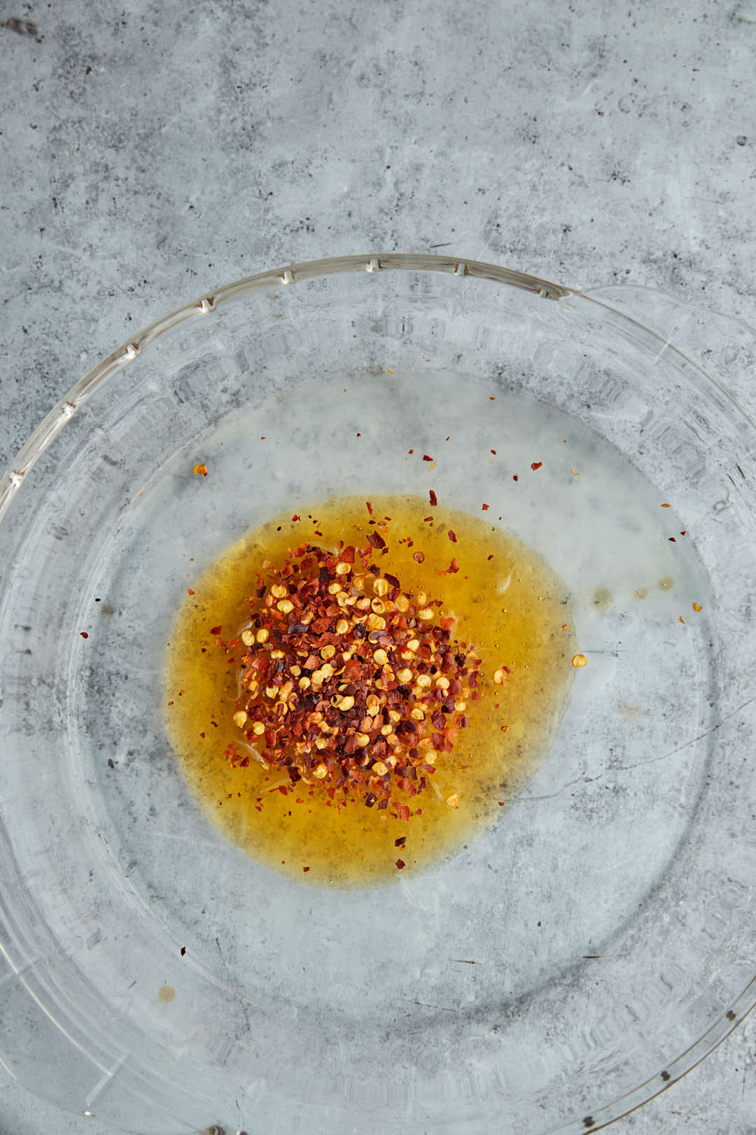 ingredients for hot honey sauce in a glass bowl.