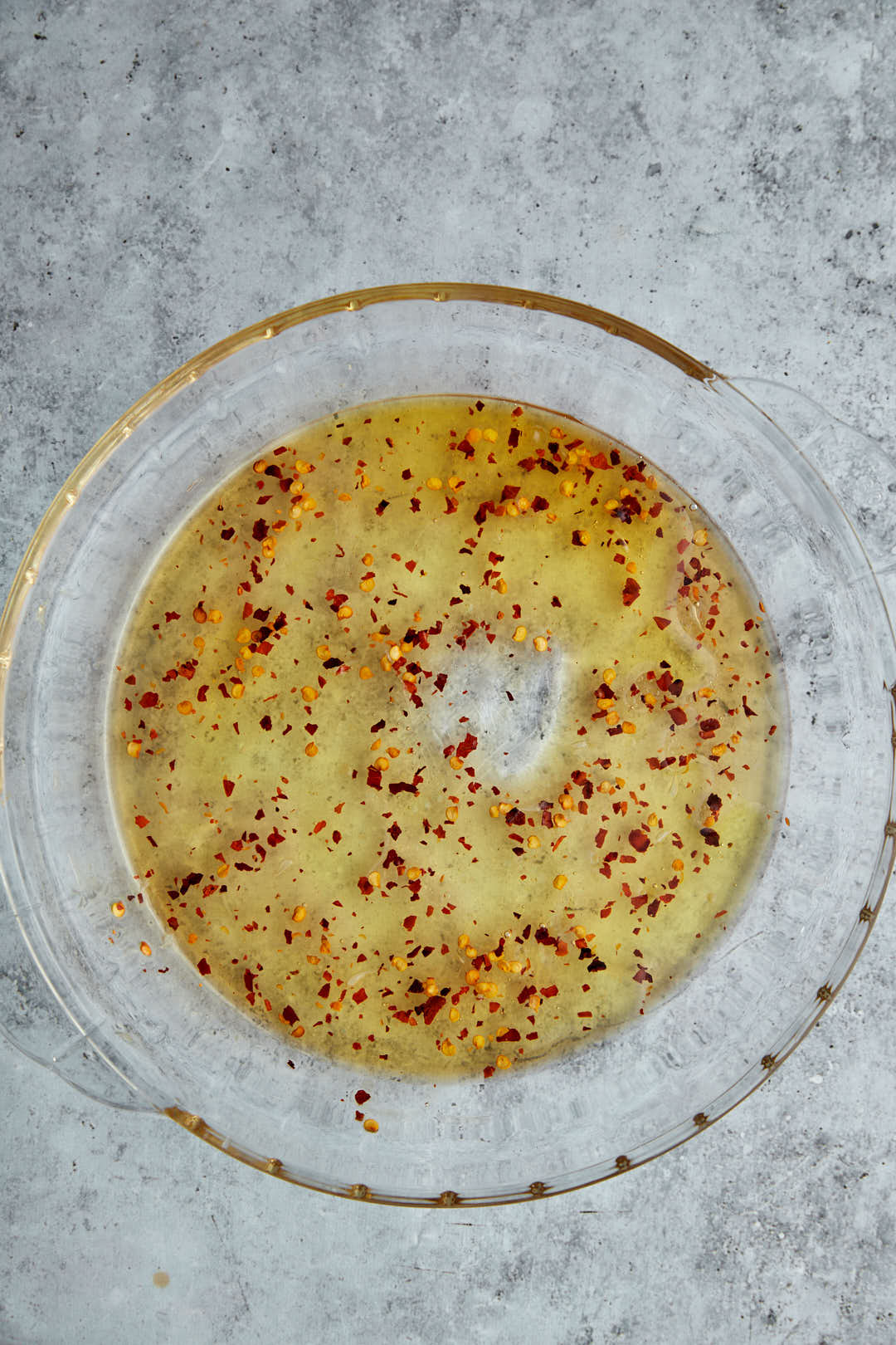 hot honey sauce in shallow glass bowl.