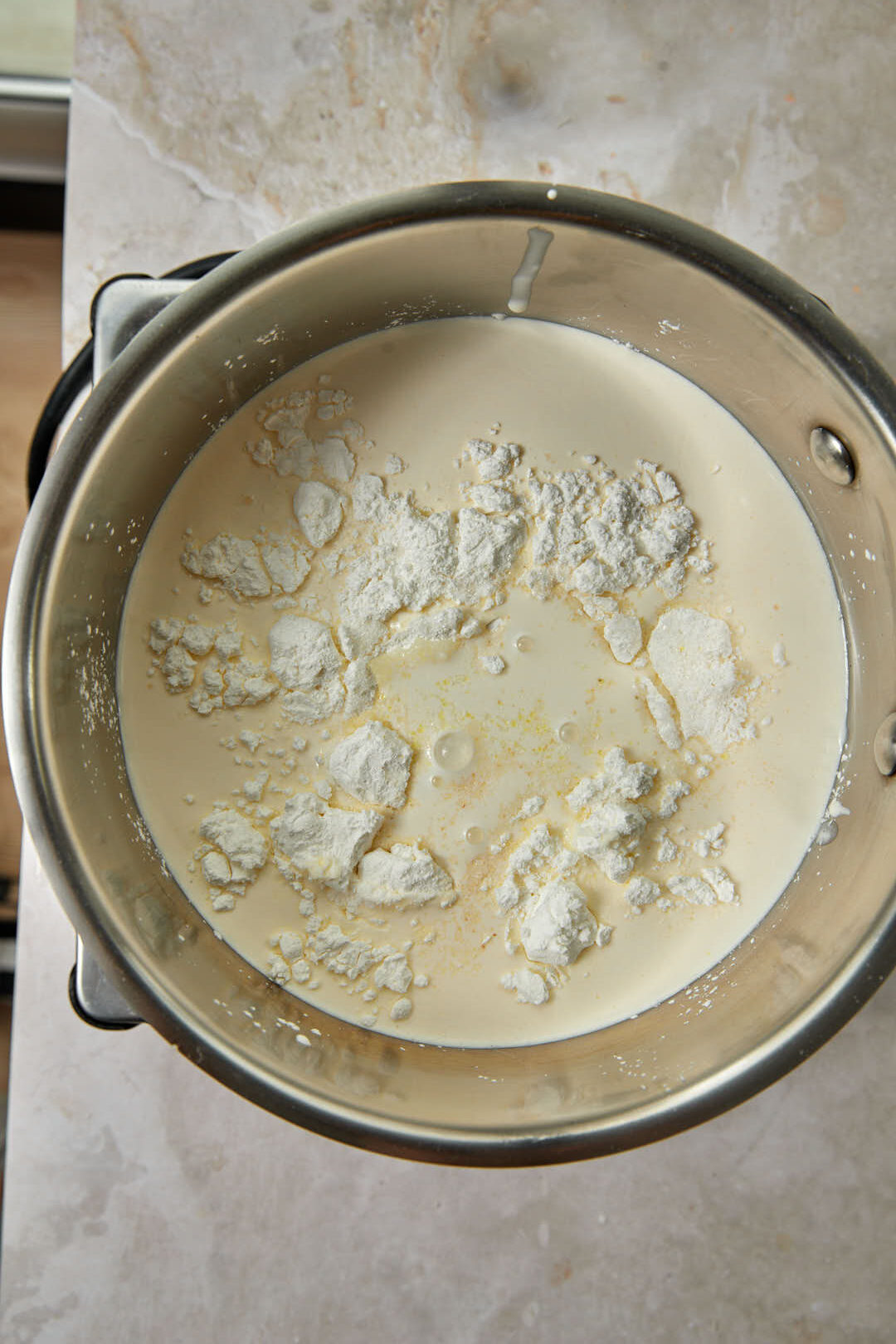 ingredients for kunafa cream mixture in a saucepan.