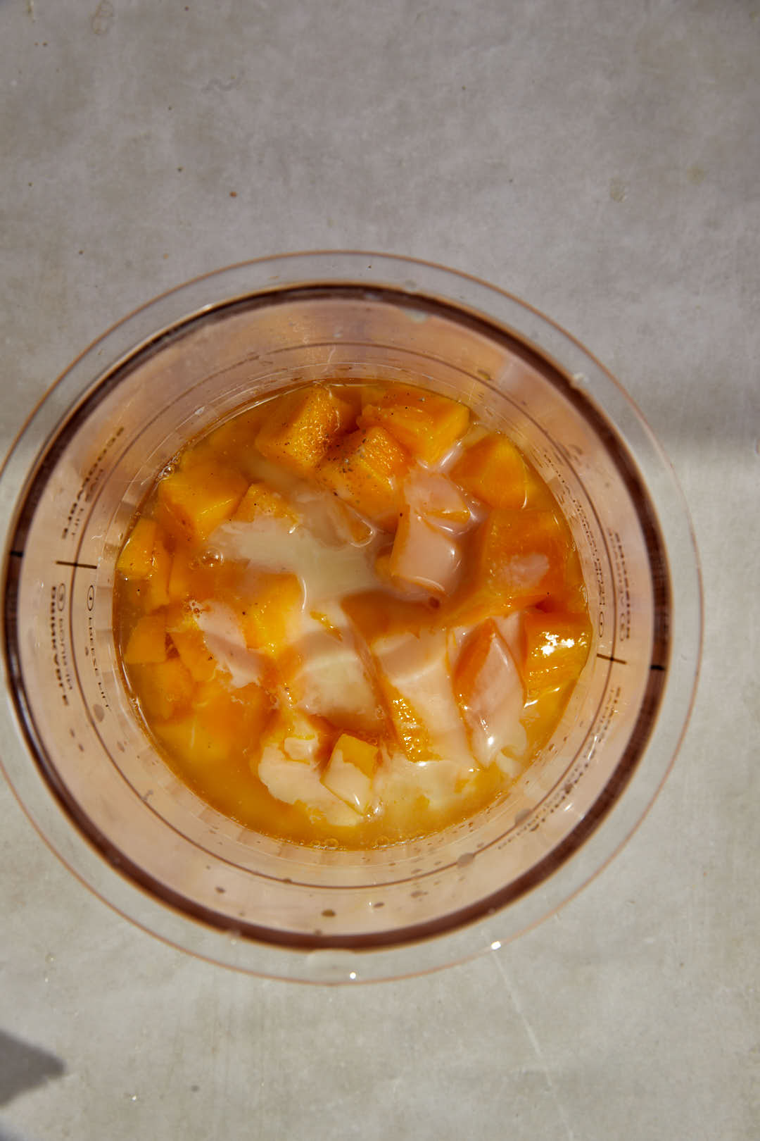 mango sorbet ingredients in ninja creami pint.