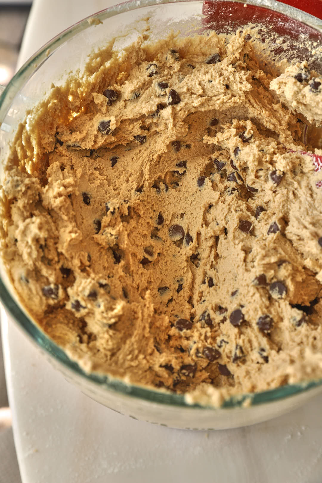 chocolate chip cookie dough in a stand mixer bowl.