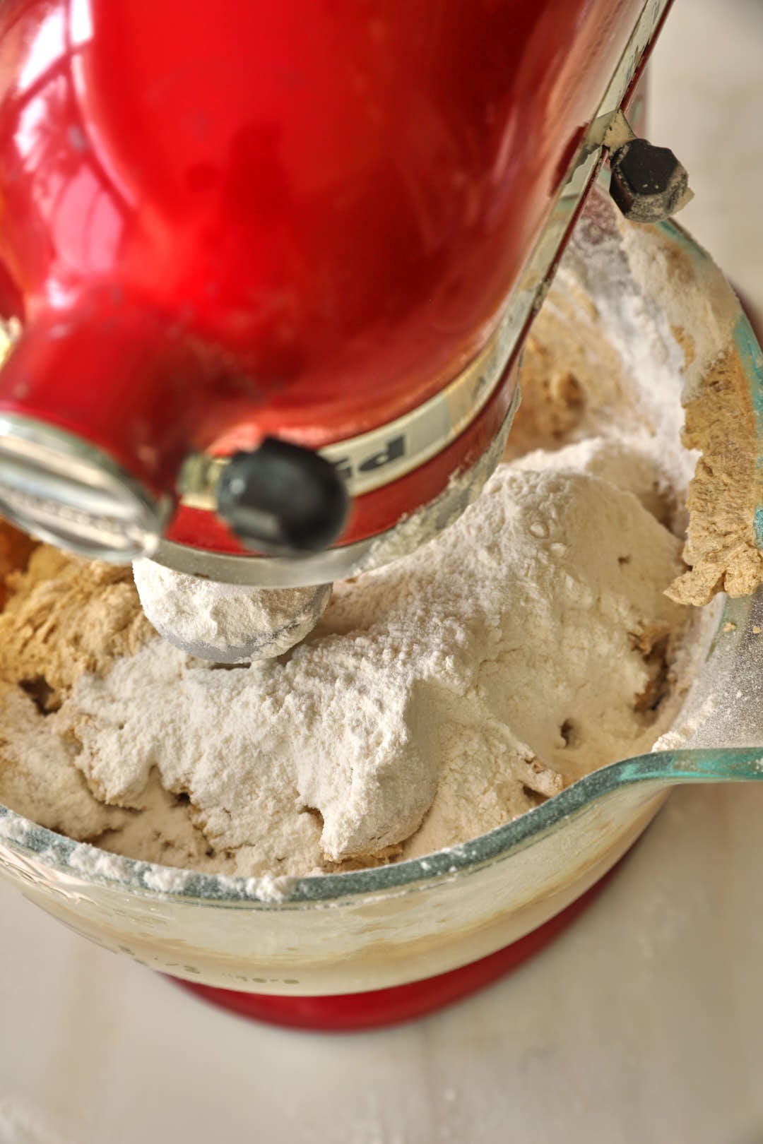flour added to cookie dough in a stand mixer.