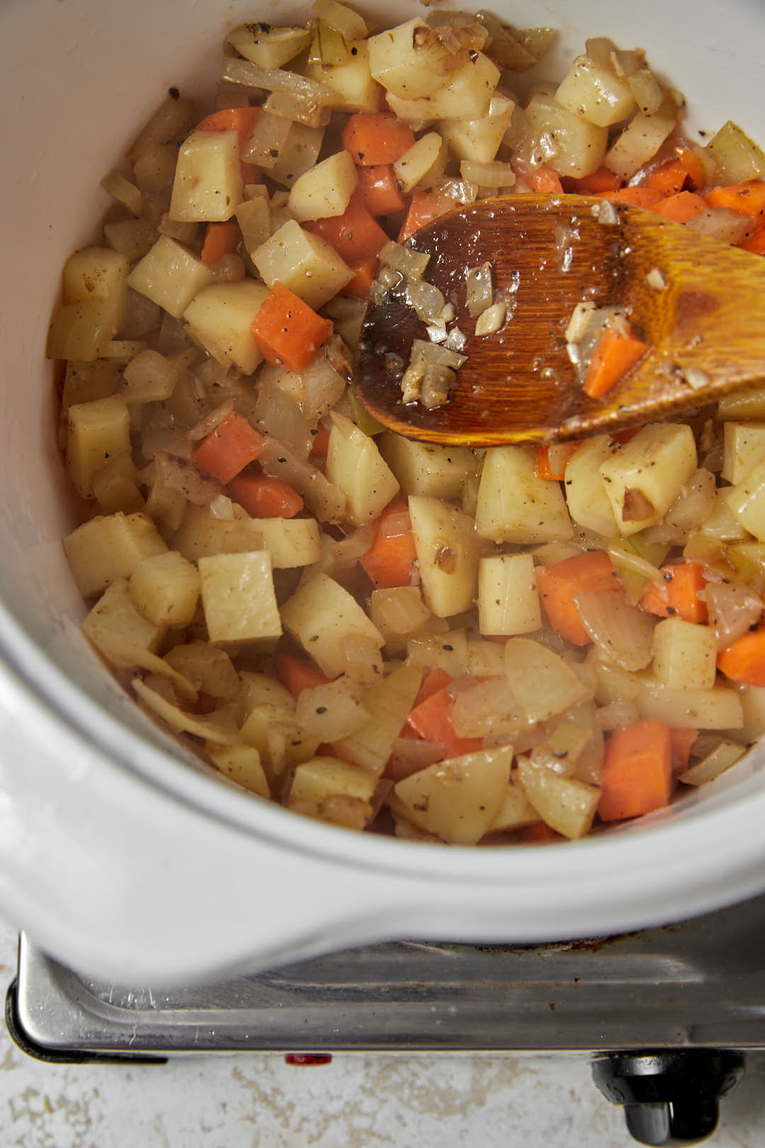 sauteed vegetables in  white saucepan.