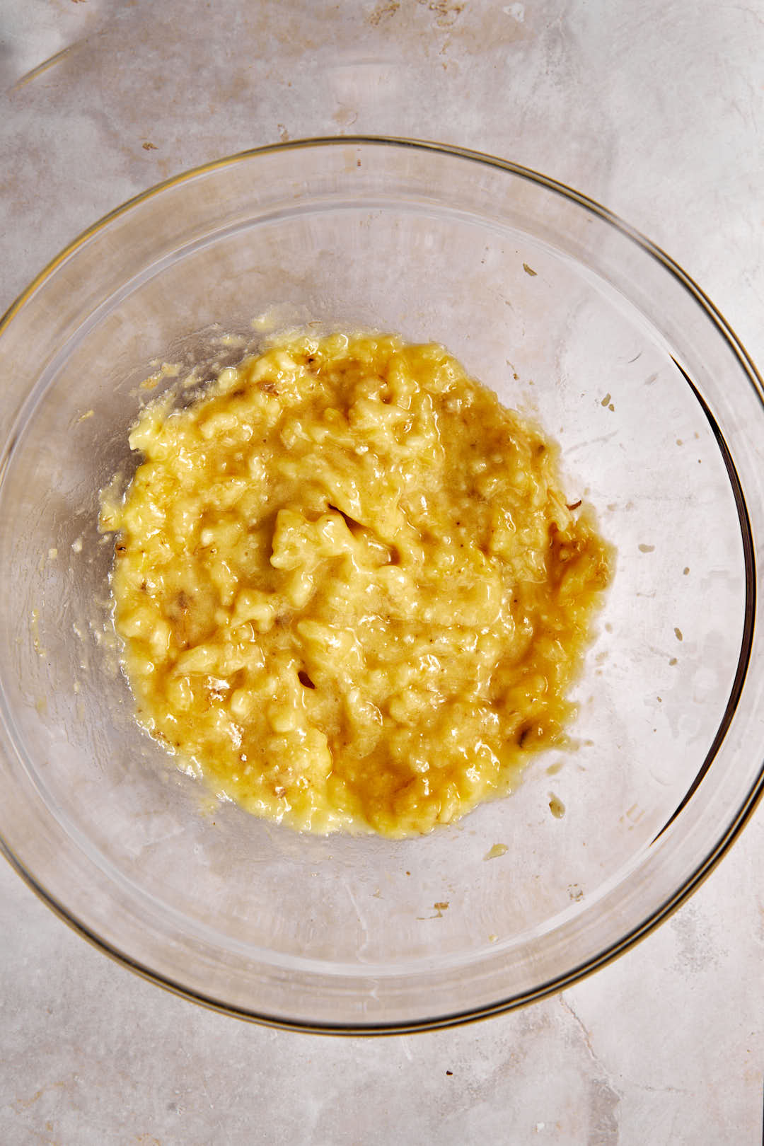 mashed bananas in a glass bowl.