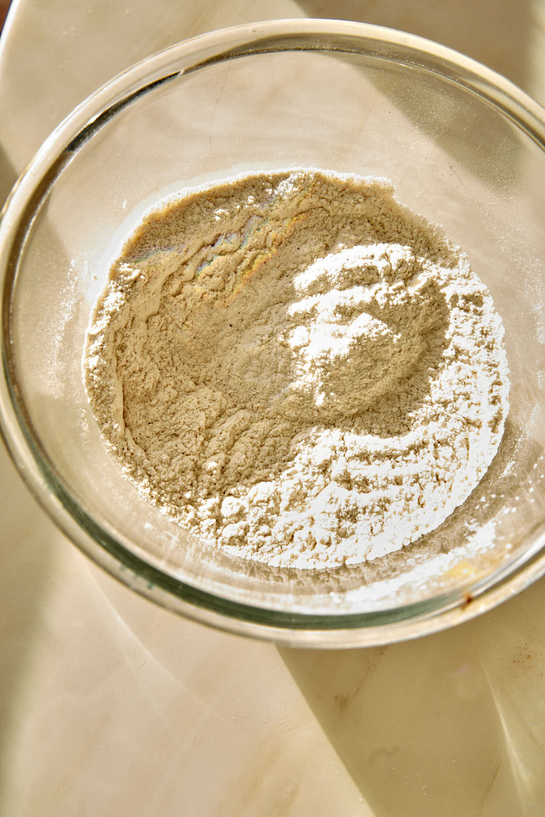 mixed dry ingredients for cake in a glass bowl.