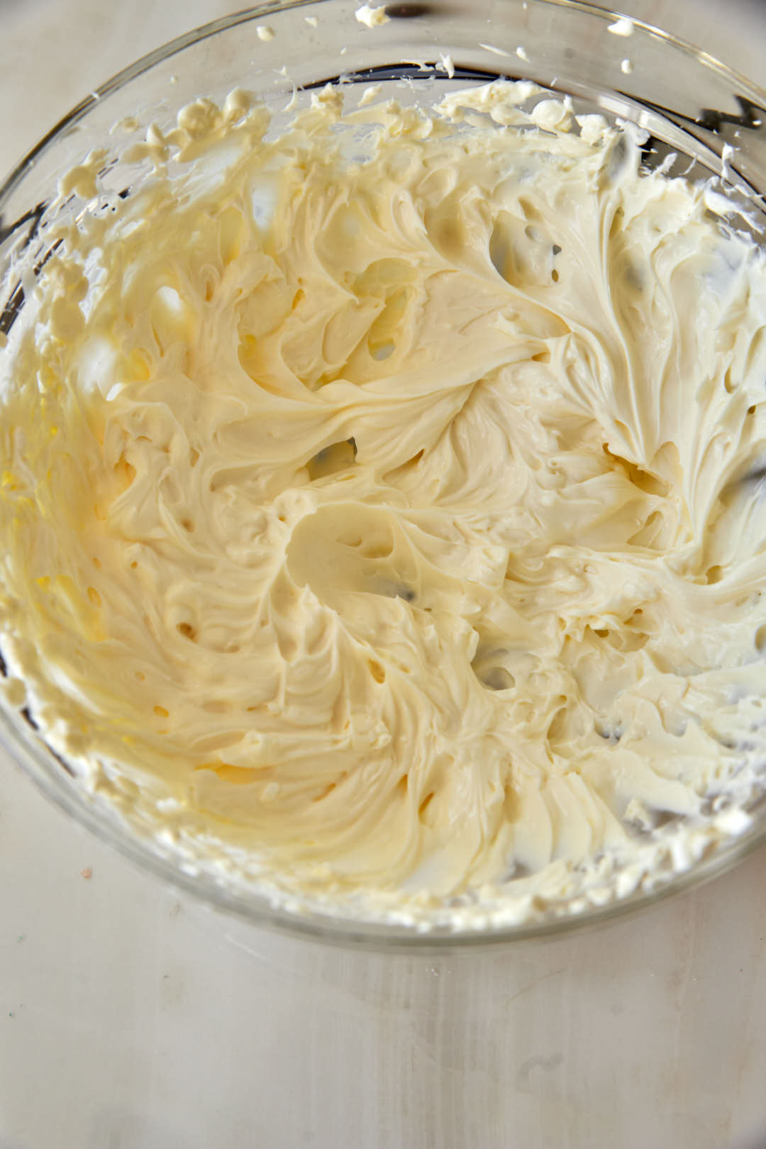whipped cream cheese in a glass bowl.