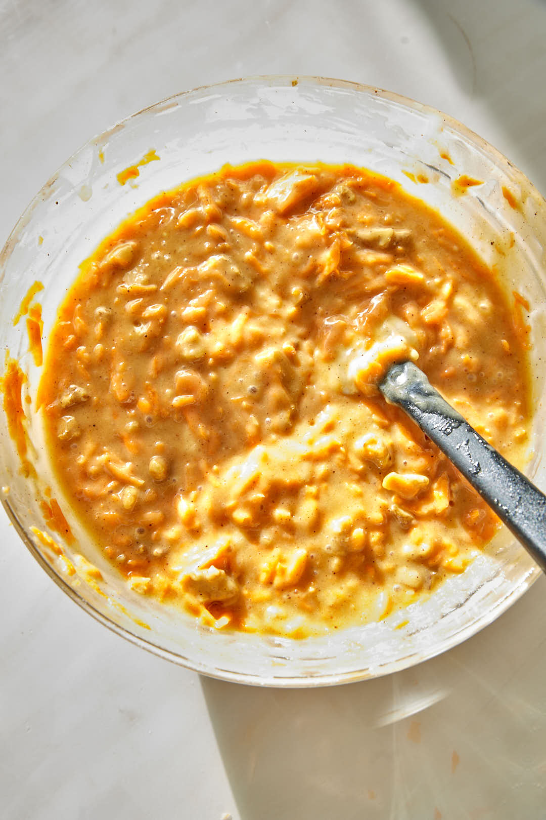 carrot cake batter in a glass bowl.