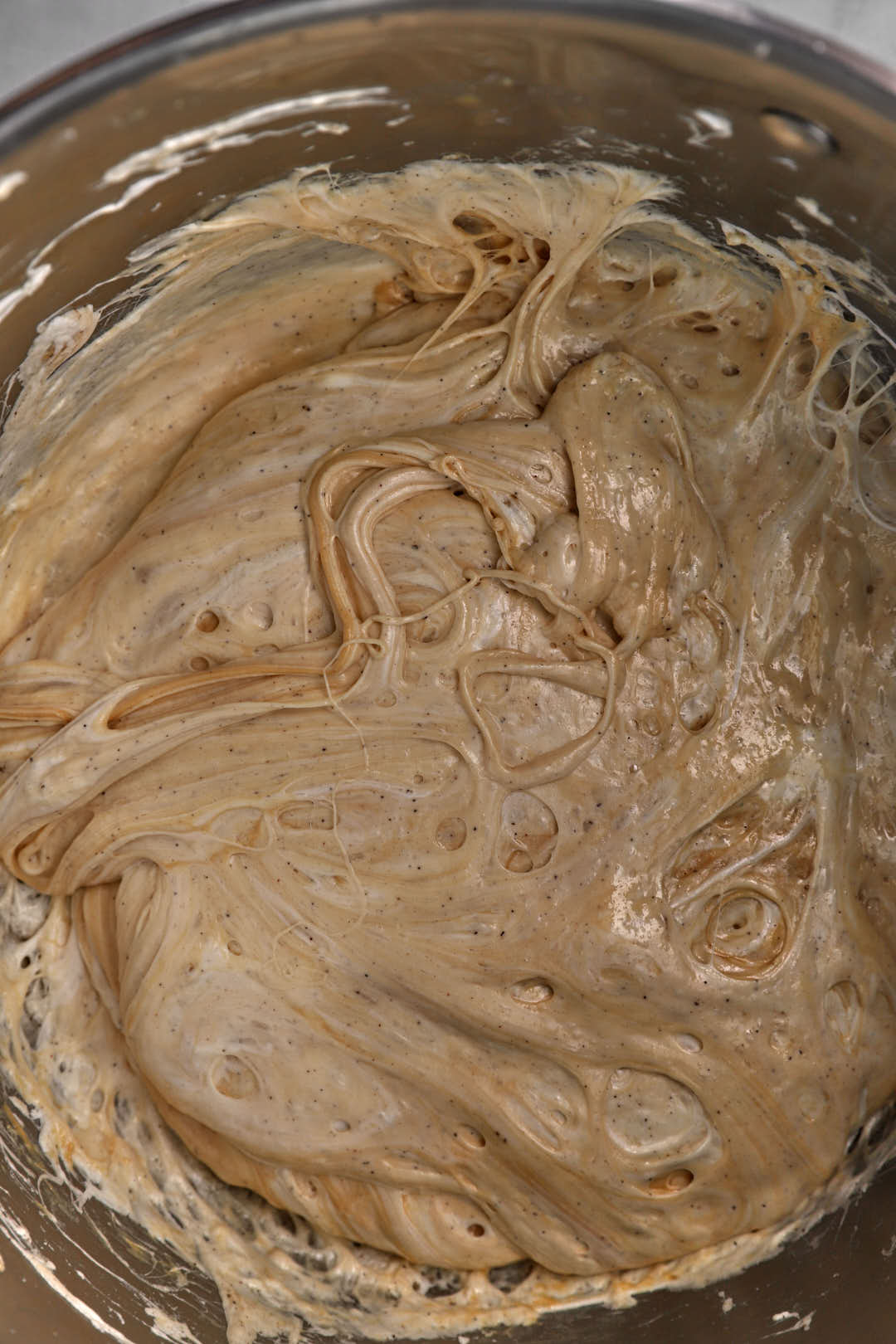 peanut butter stirred into melted marshmallows in a large pot.