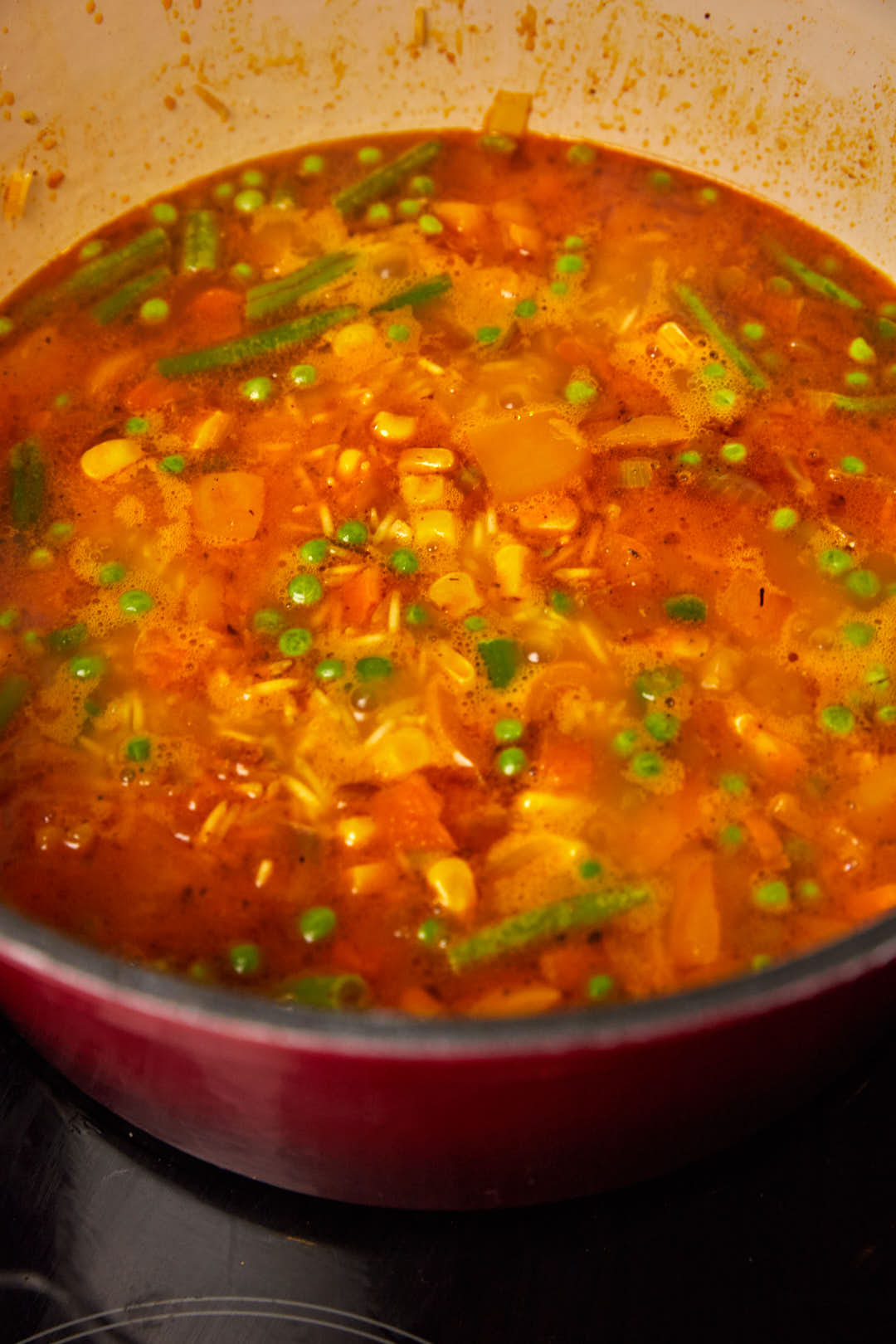 chicken stock added to basmati rice in a large pot.