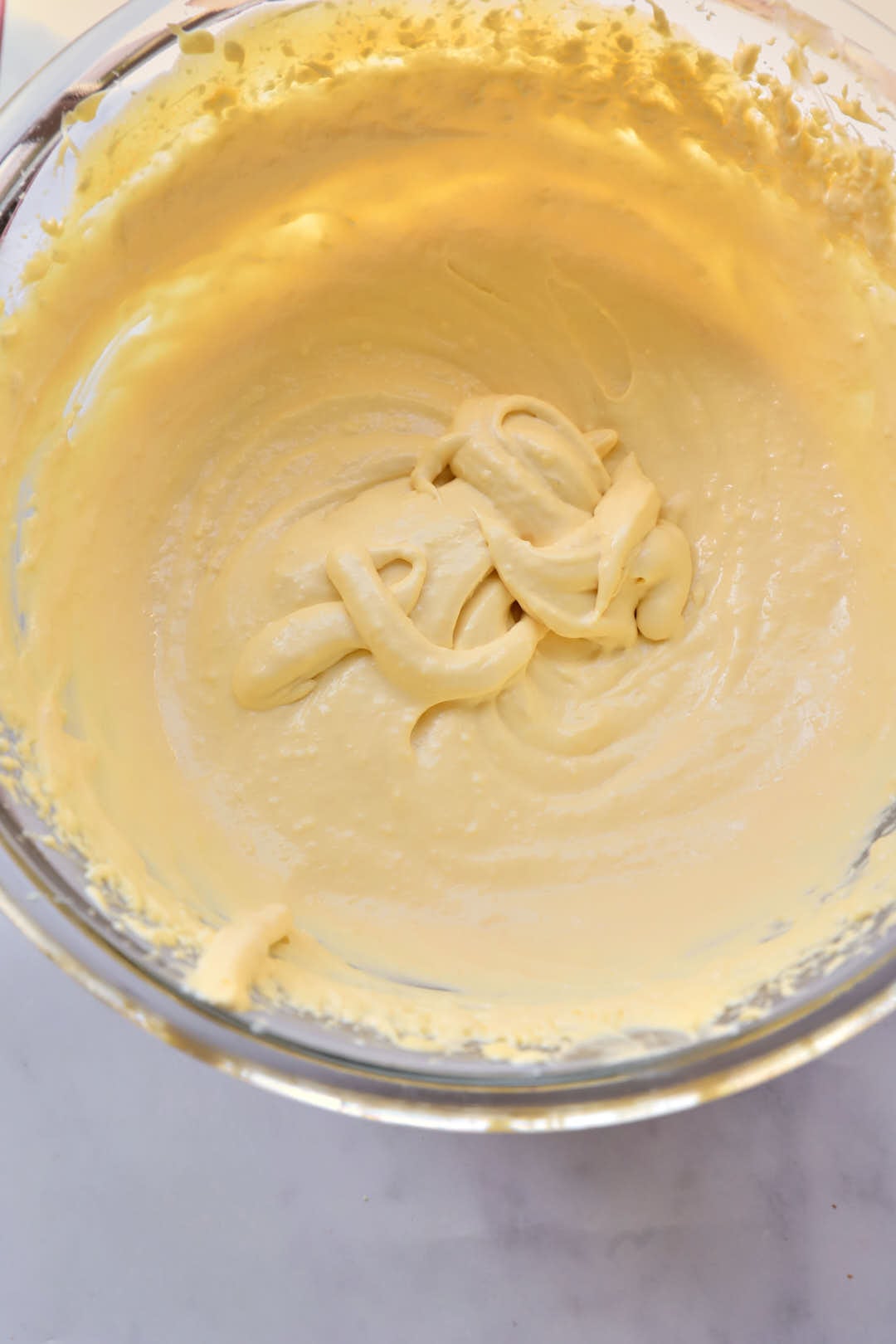 trifle cream in a pyrex glass bowl.