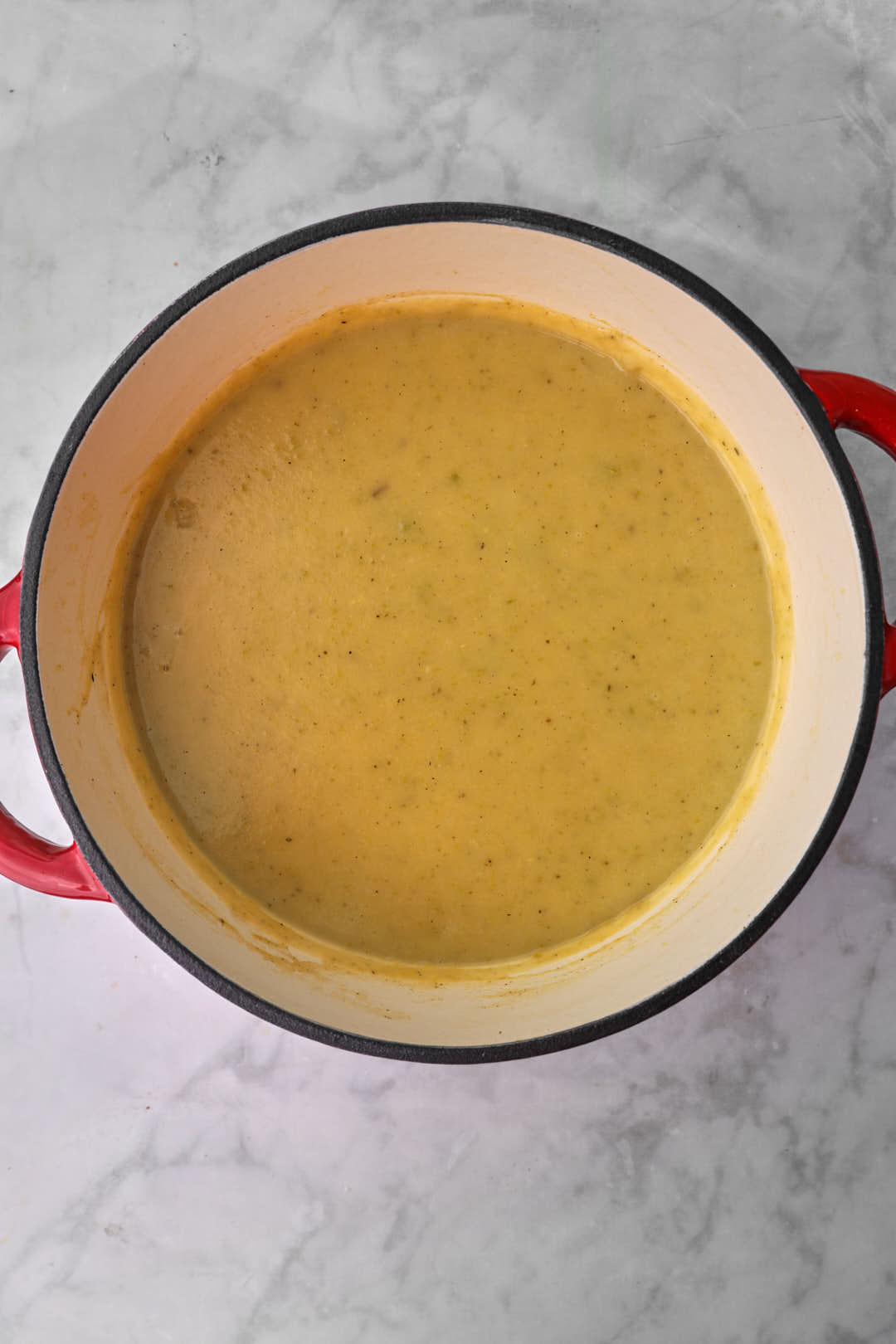pureed zucchini and potato soup in a saucepan.