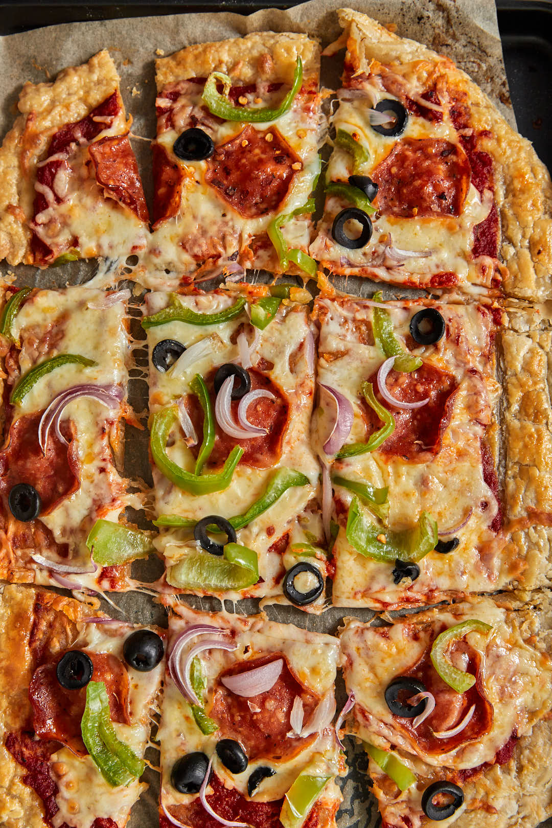 close up photo of puff pastry pizza squares