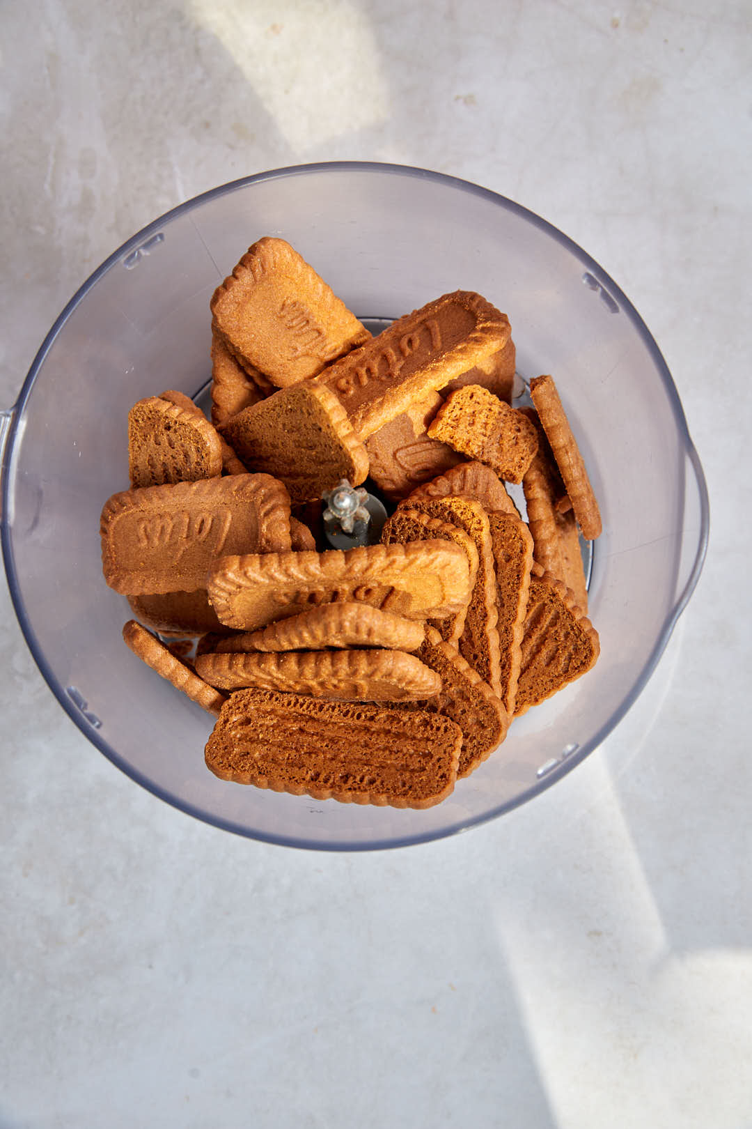 lotus biscuits in bowl of food processor