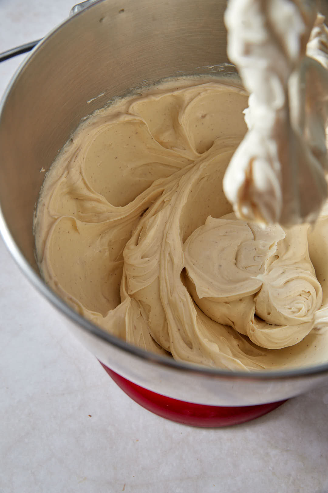 Whipped cream cheese and sugar in mixer bowl.