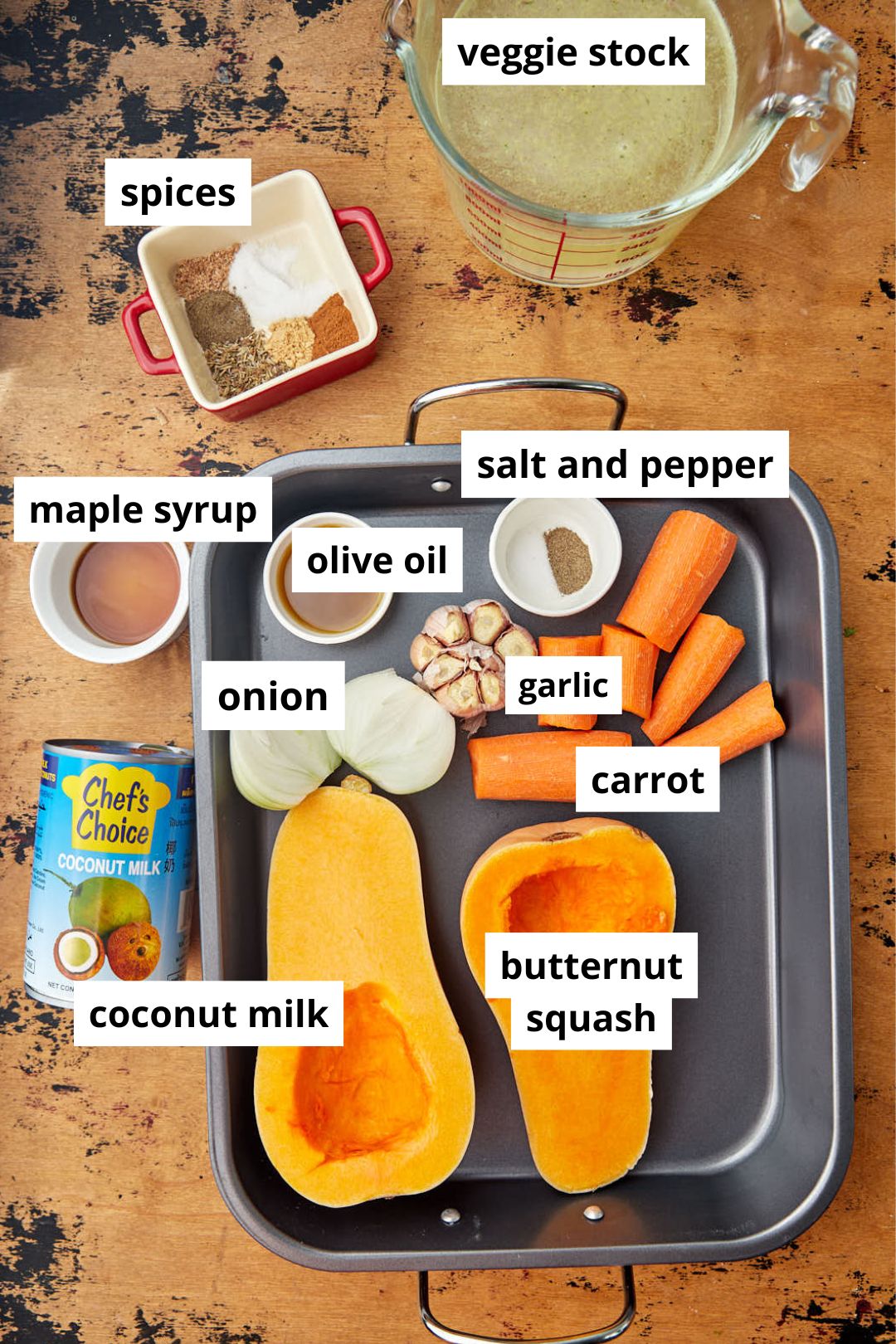 ingredients for roasted carrot butternut squash soup on wooden background.