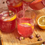 Rose lemonade being poured out into a glass.