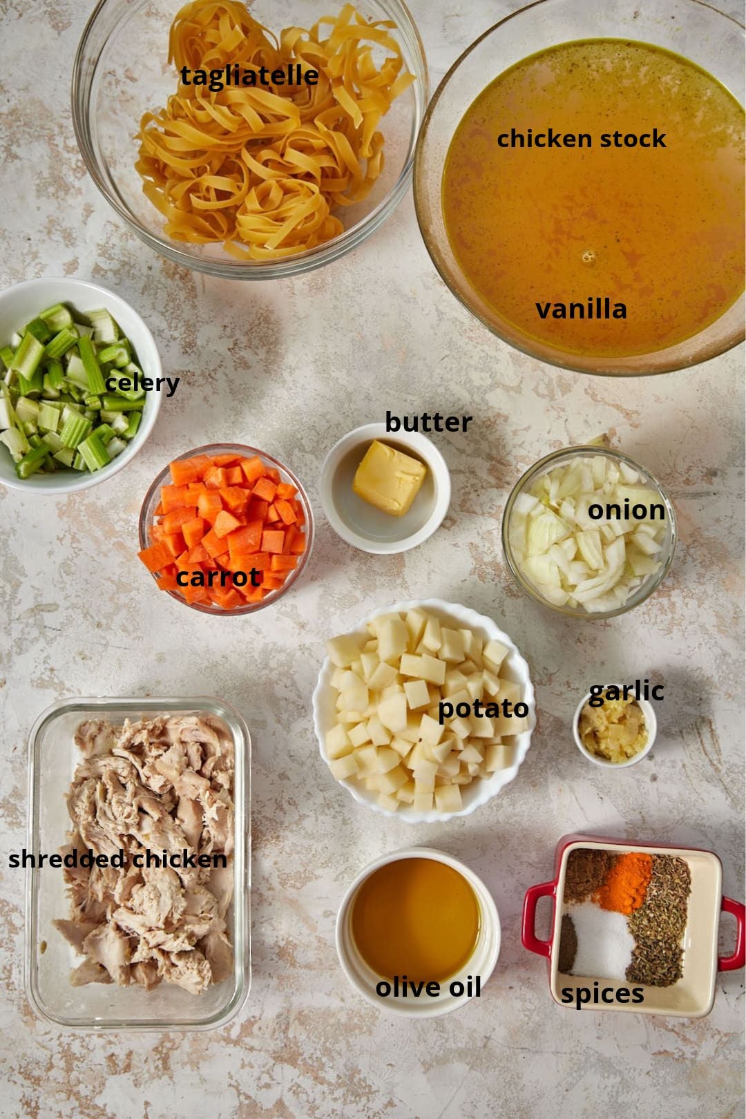 ingredients needed to make rotisserie chicken soup on a white background.