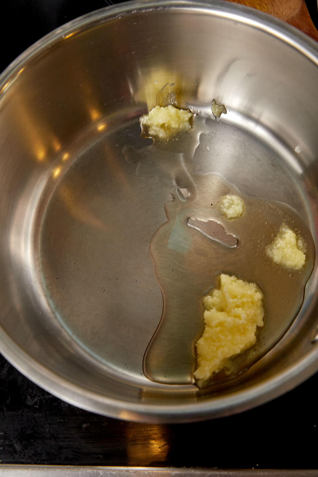 ghee melting in a large pot.