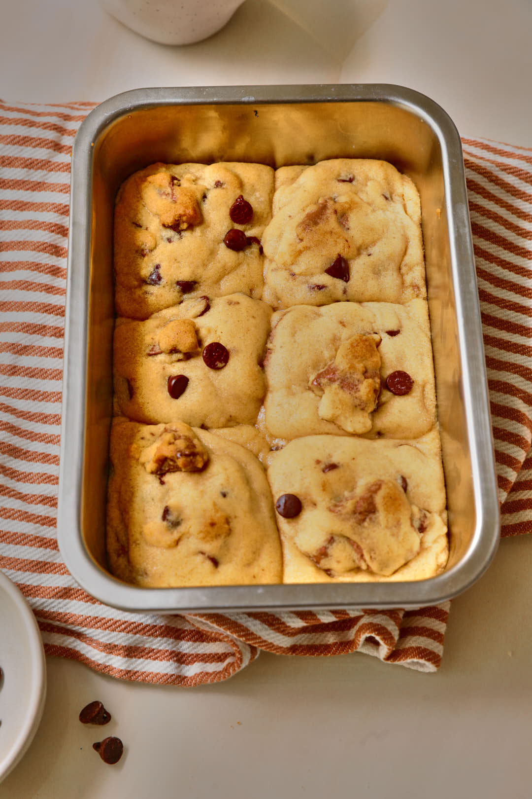 scoopable cookie dough after baking in metal baking pan.