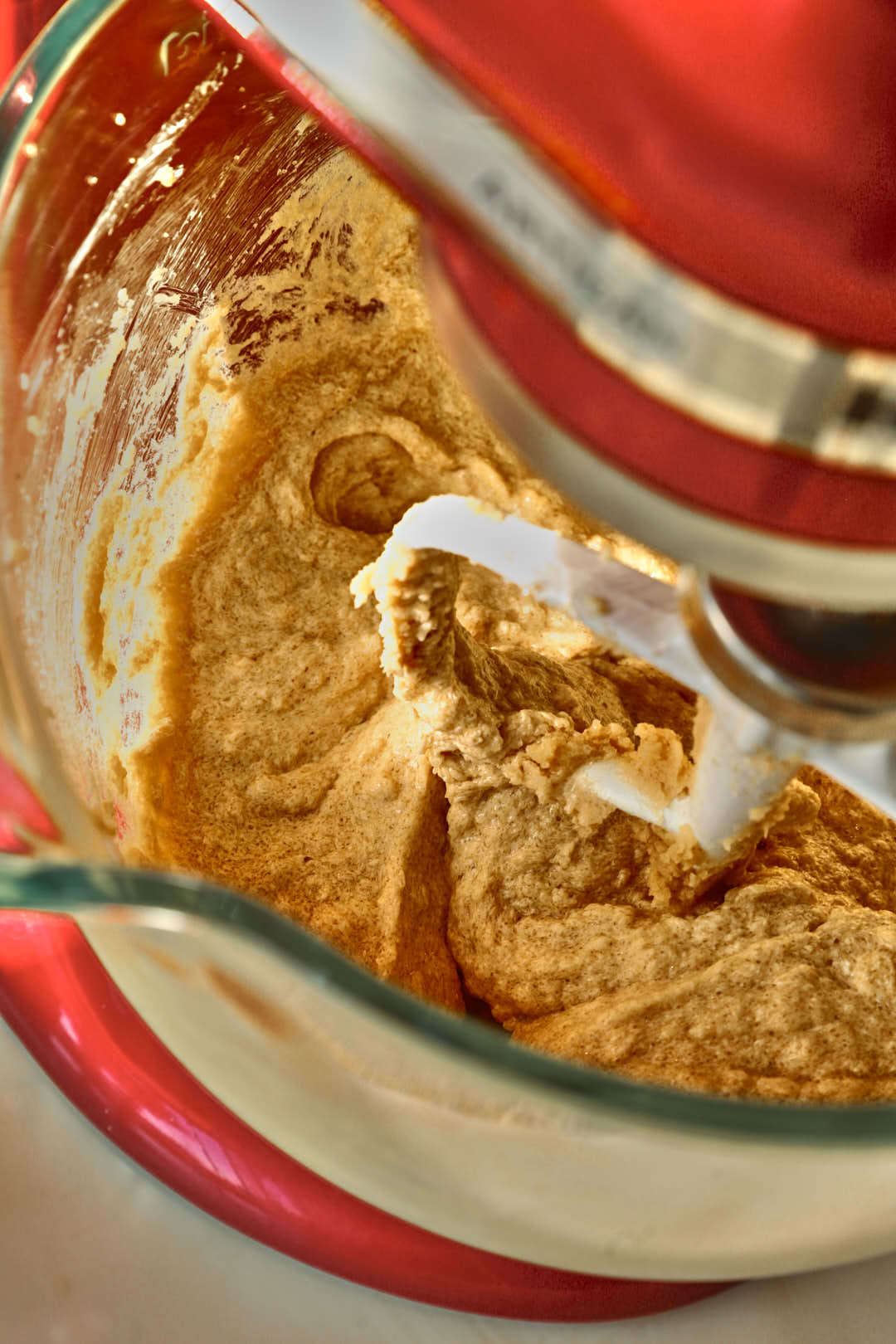 cookie dough in bowl of glass stand mixer.