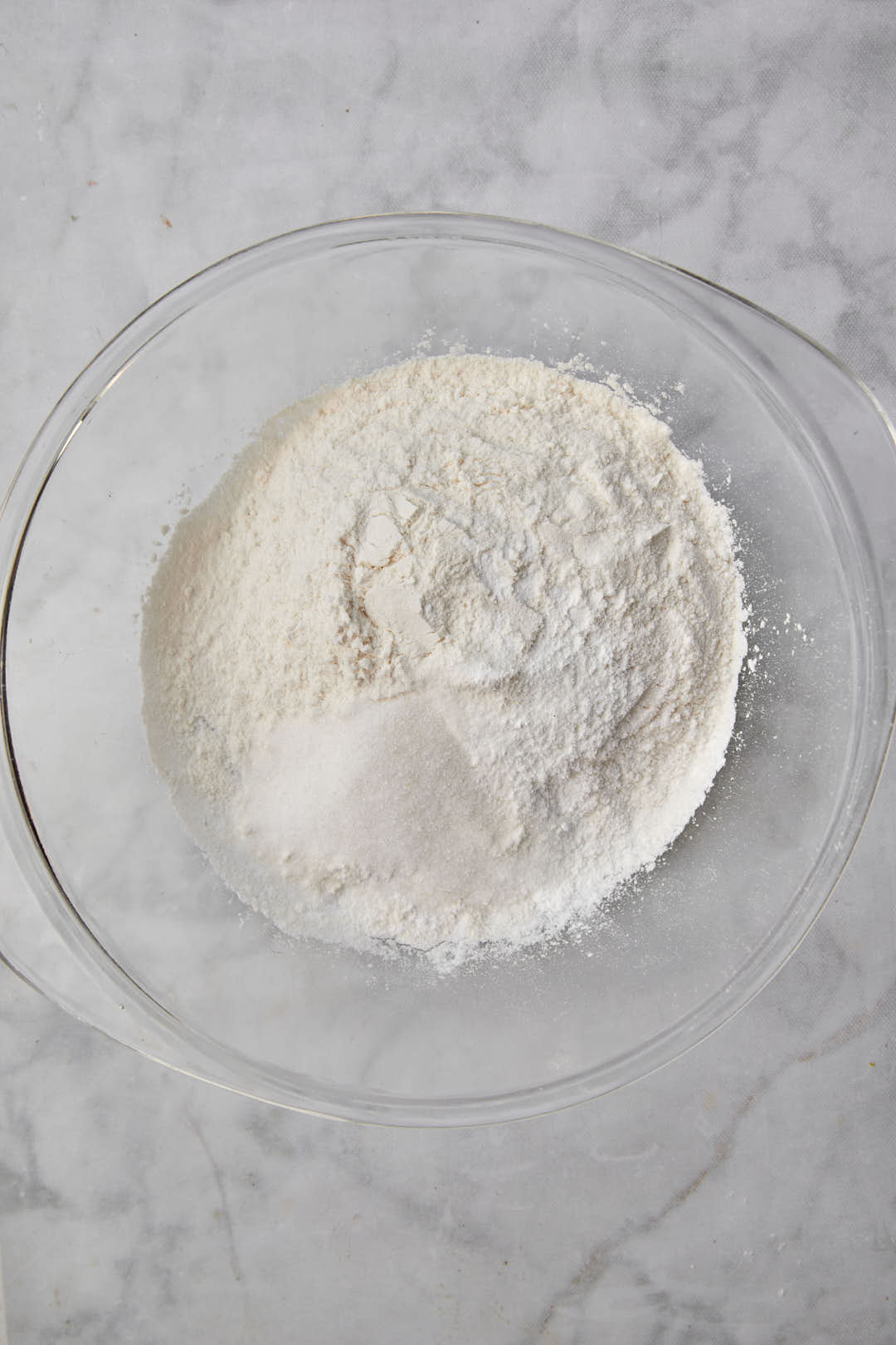 flour sugar baking powder and salt in a glass bowl.