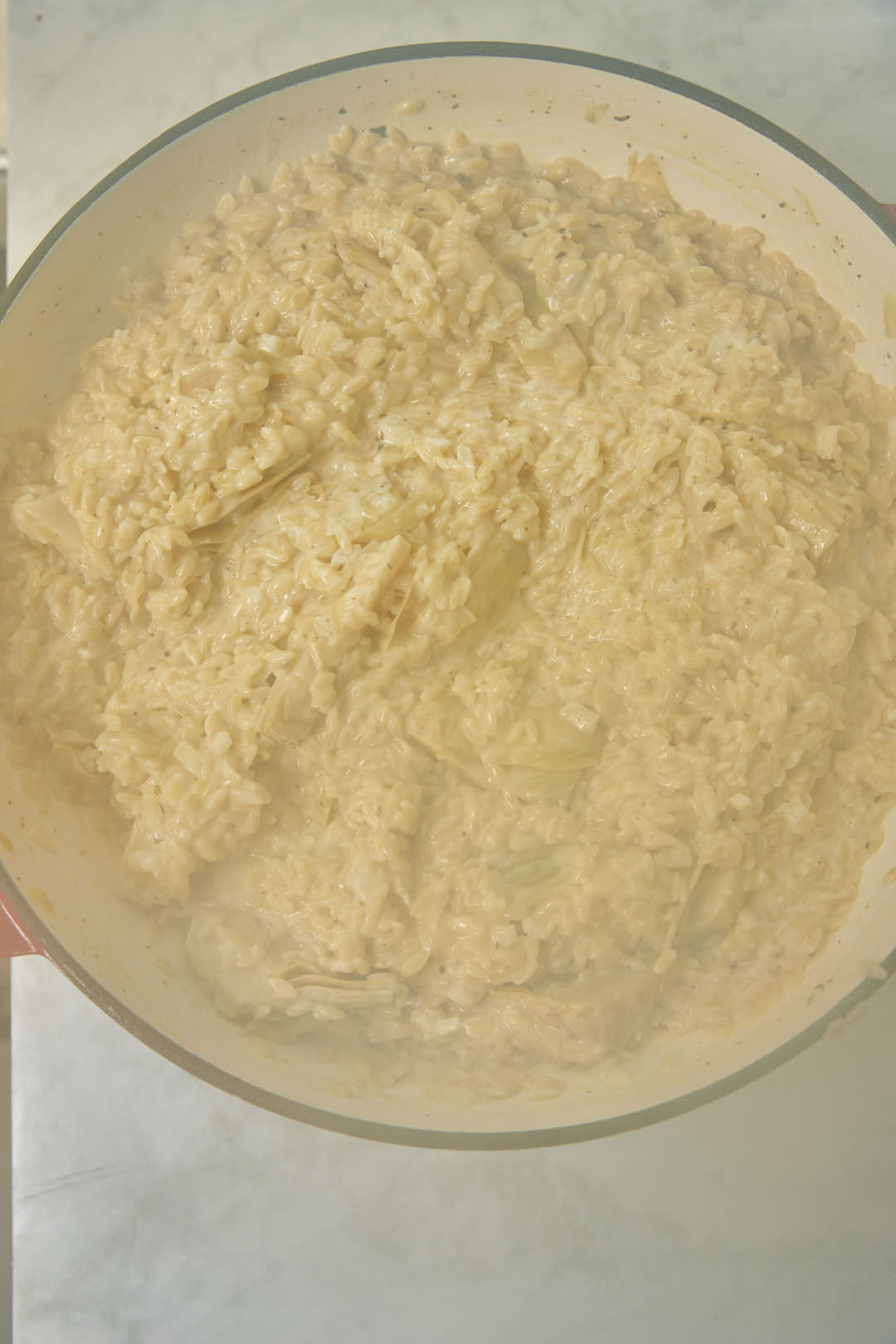 orzo in a large skillet after cooking.