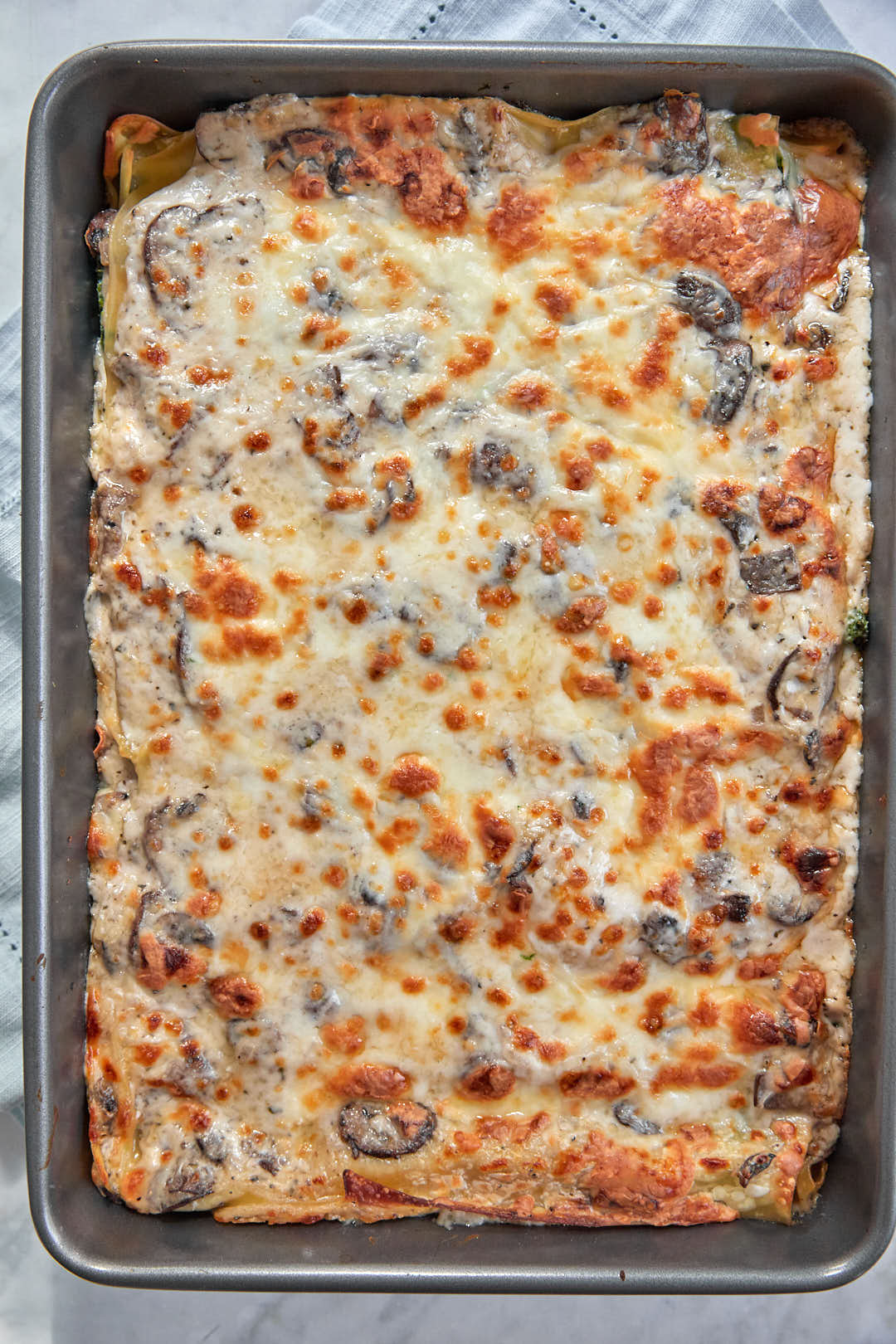 golden brown vegetable bechamel lasagna after baking.
