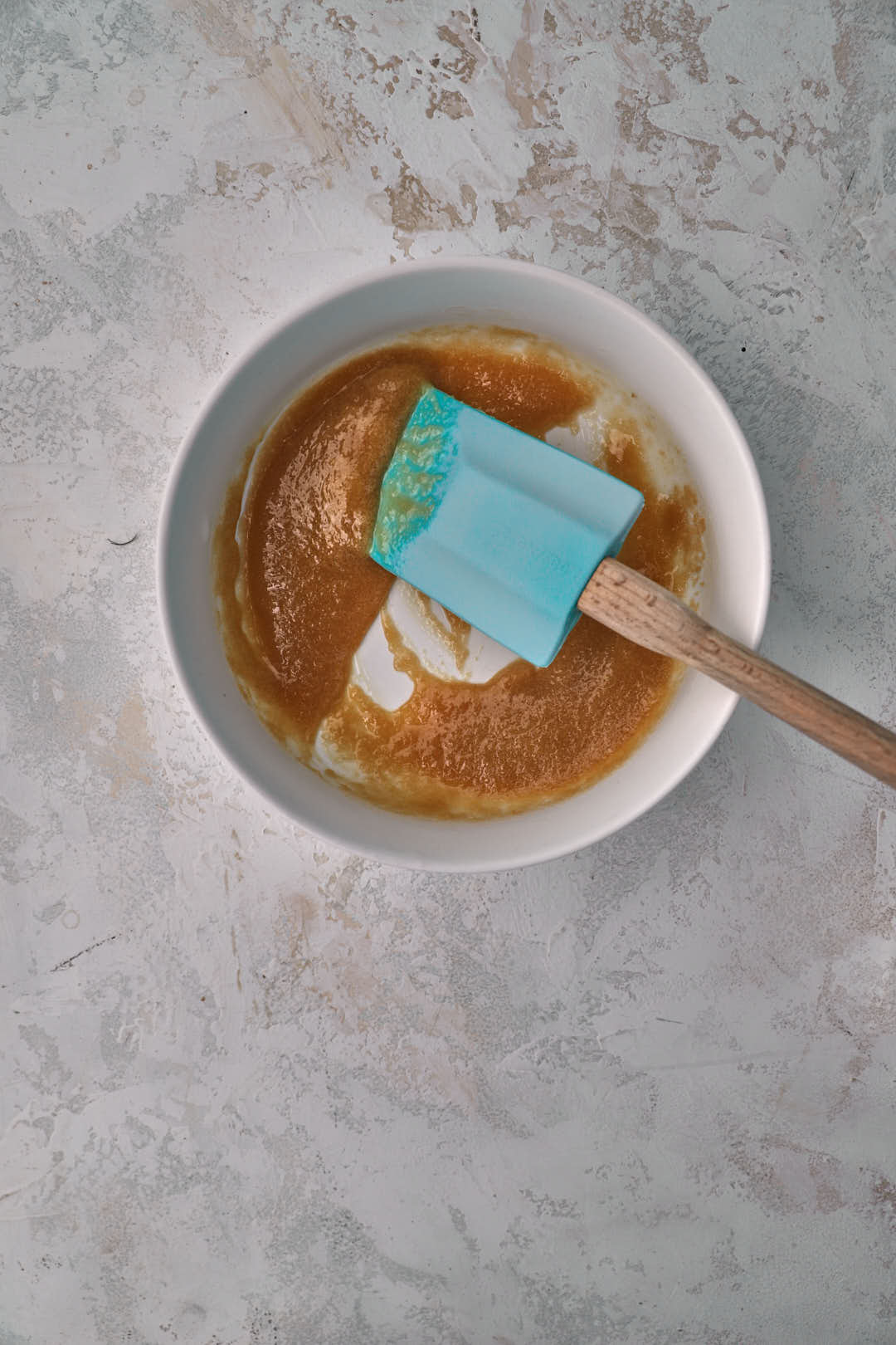 butter and sugar mixed together in a small white bowl.