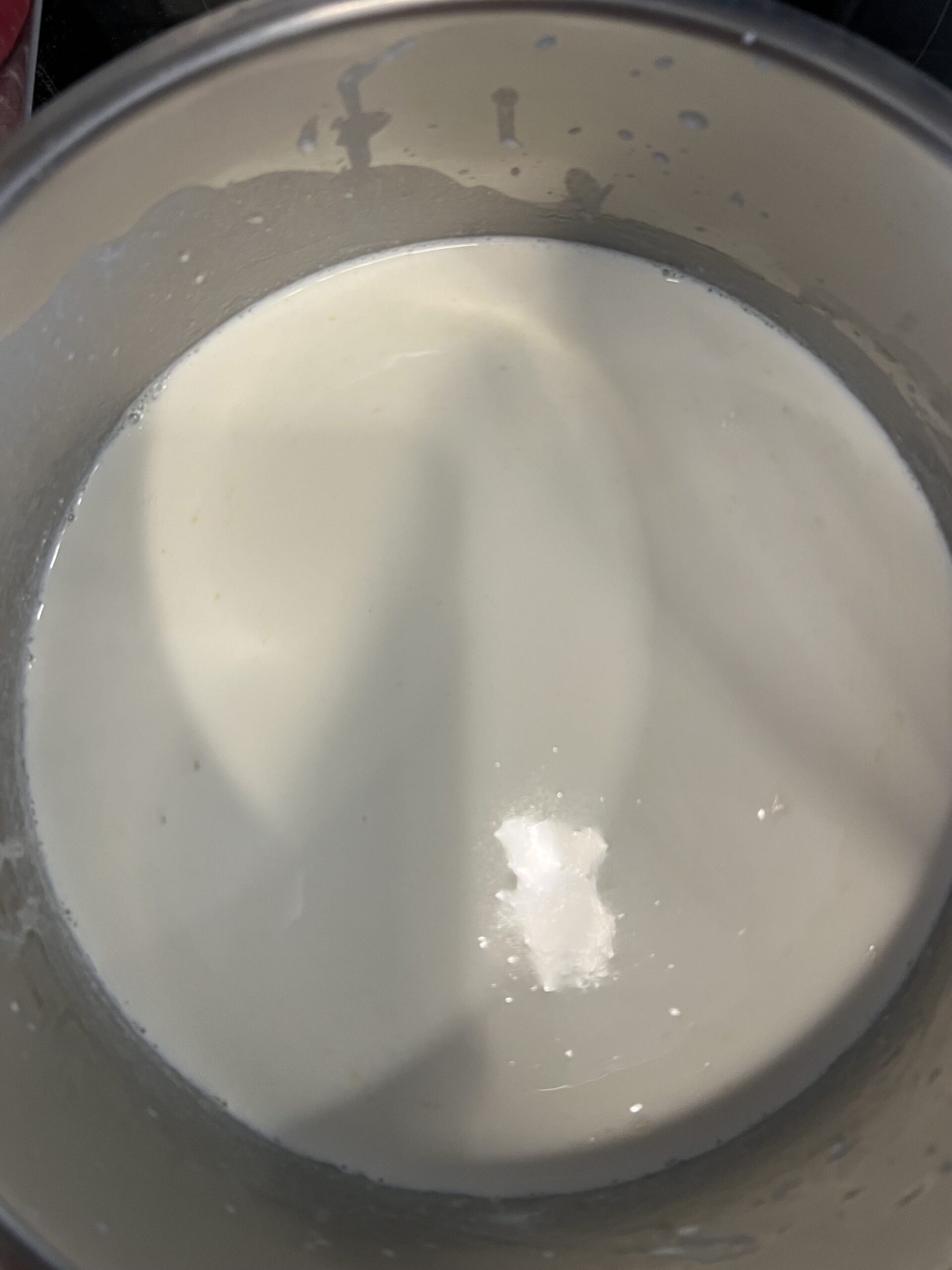 milk and cream added to butter and flour for bechamel.