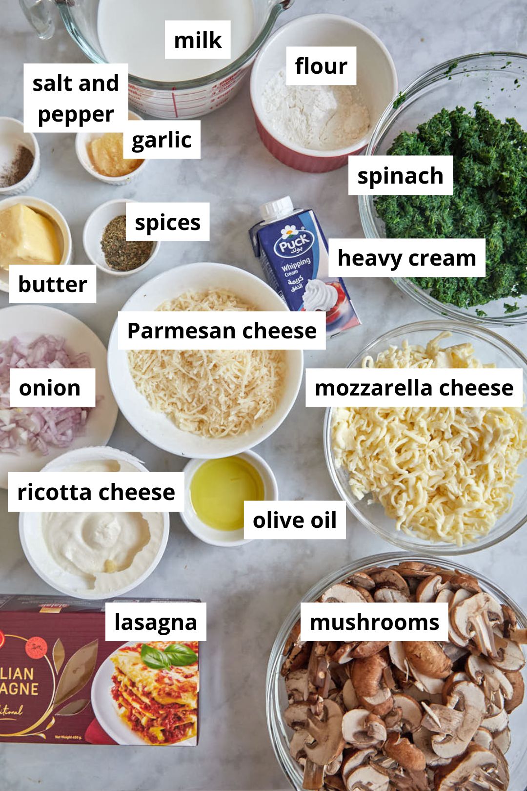 ingredients you need to make spinach bechamel lasagna on white background.