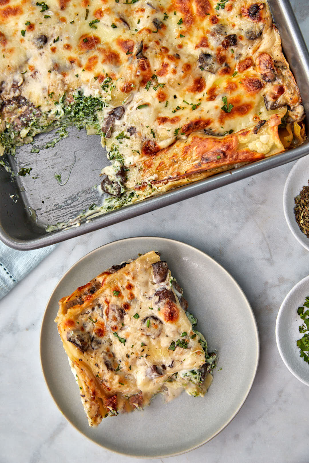 slice of vegetarian lasagna on a gray plate.